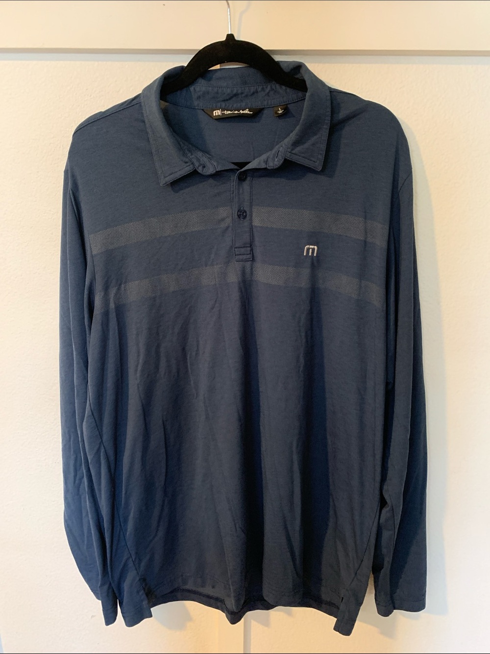 Travis Mathew Long-Sleeve Polo in Deep Blue with Subtle Chest Stripes